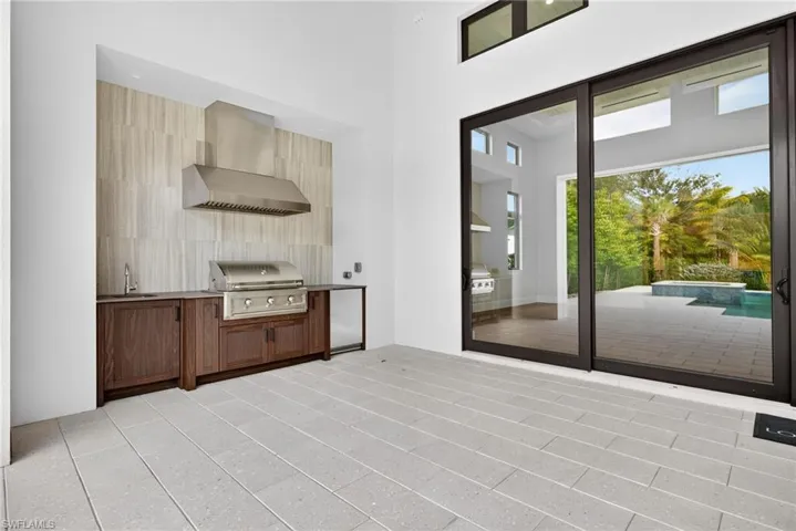 patio / terrace with area for grilling and dining