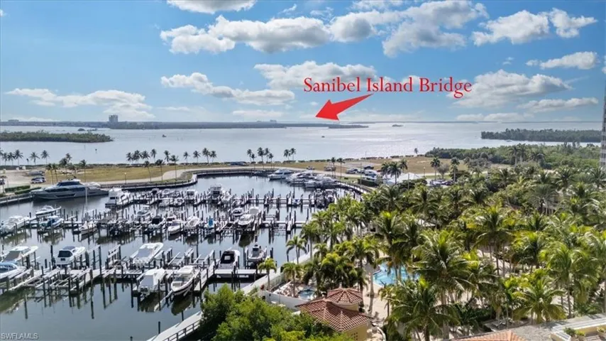 Aerial view of numerous boat docks and a nearby body of water