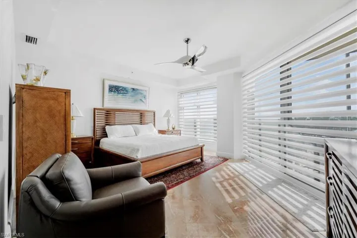 Bedroom featuring ceiling fan and wood finished floors