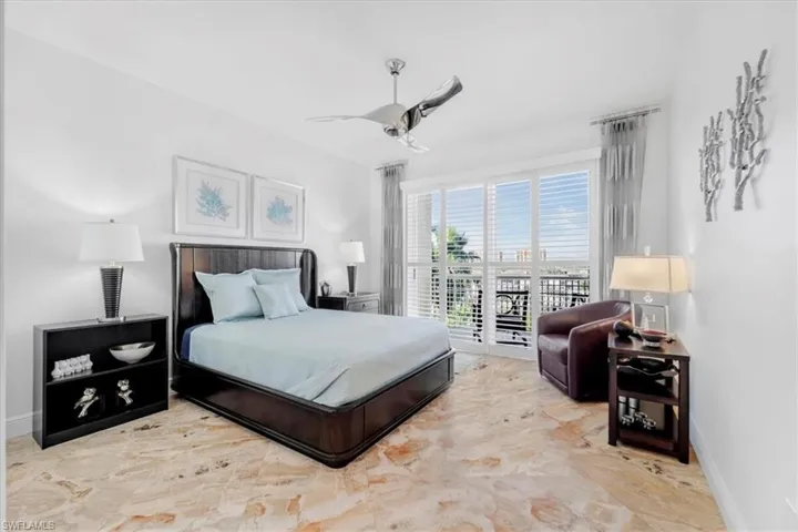 Bedroom featuring access to outside and ceiling fan
