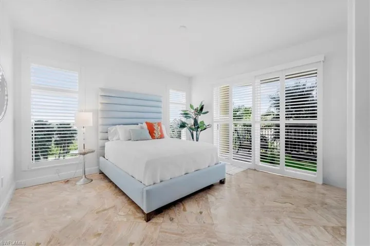 Bedroom with multiple windows