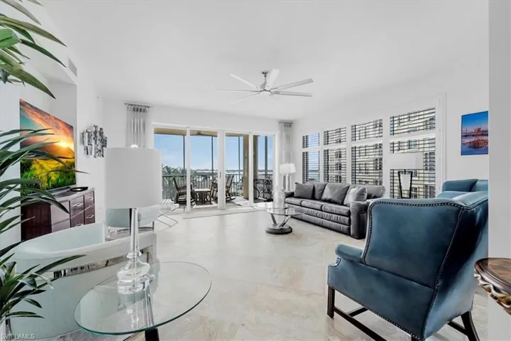 Living room featuring a ceiling fan