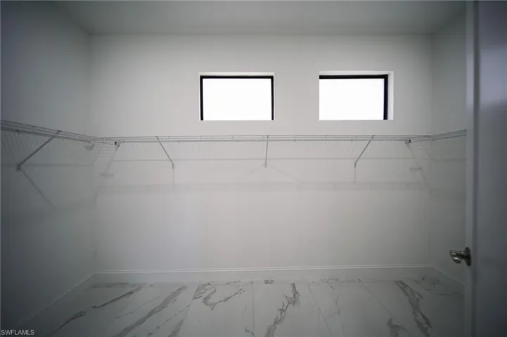 Spacious closet with marble finish flooring