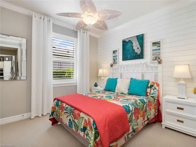 Middle Guest Bedroom with Shiplap Accent Wall, Ceiling Fan, Crown Molding, Plantation Shutters & Custom Curtains