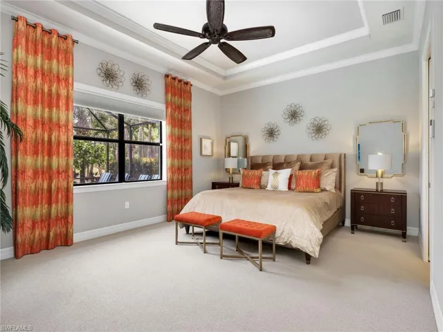 Primary Bedroom with Tray Ceiling, Crown Molding, Ceiling Fan, Custom Window Curtains,  Battery Powered Motorized Blackout Shade & Golf Course View of 17th Hole
