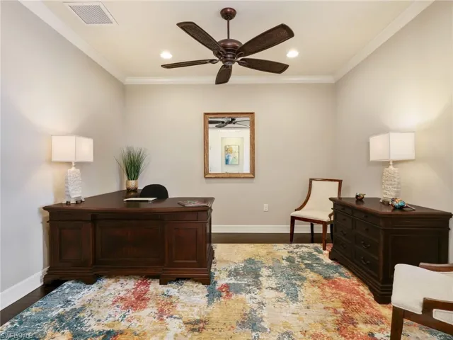Den with Crown Molding, Ceiling Fan, Wood Flooring & Extra Recessed Lighting