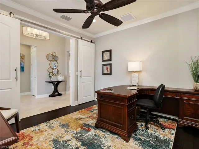 Den with Crown Molding, Ceiling Fan, Wood Flooring,Sliding Barn Doors for Privacy & Extra Recessed Lighting