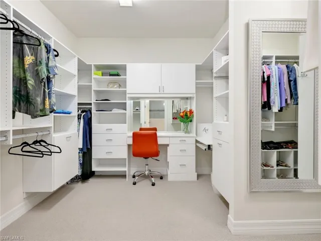 Primary Closet with Custom California Built-In Closet with Security Lock for Jewelry, Vanity,  Built-In Ironing Board, Shoe Storage & Dual Hampers