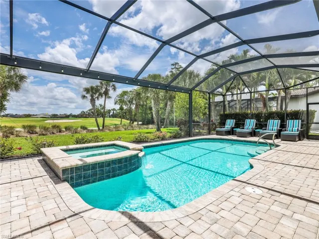 Lighted Heated Pool & Spa with Gas & Solar Heating with Fantastic View of the 17th Hole of the Golf Course, Panoramic Screen Enclosure, & Privacy Hedges on Both Sides
