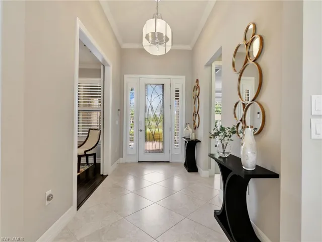 Front Entry Foyer and Modern Clear Stained-Glass Front Door, Sidelights with Plantation Shutters, & Crown Molding