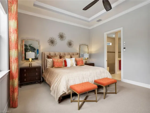 Primary Bedroom with Tray Ceiling, Crown Molding, Ceiling Fan, Custom Window Curtains,  Battery Powered Motorized Blackout Shade, & Golf Course View of 17th Hole
