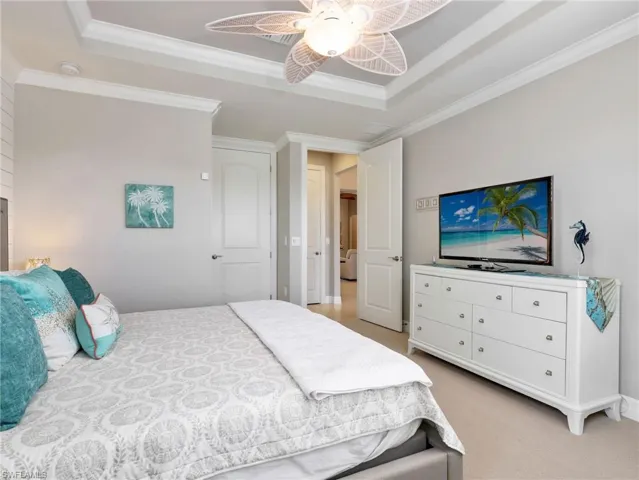 Front Guest Bedroom with Tray Ceiling, Ceiling Fan, Crown Molding & Large Walk-In Closet W/ California Closet Organizers