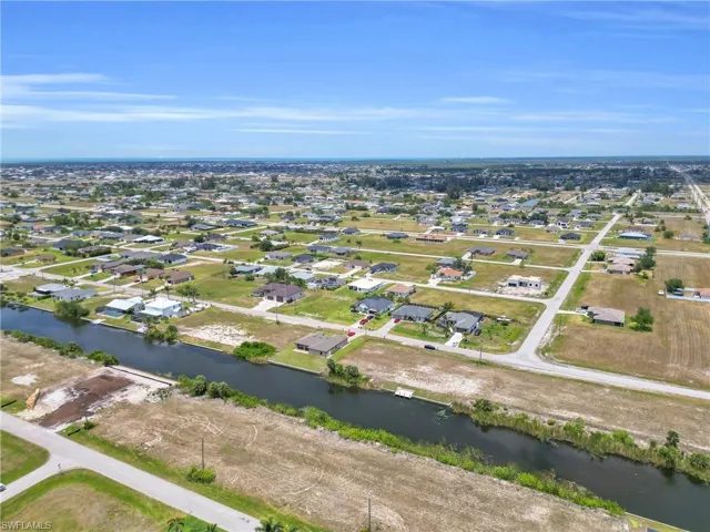 Bird's eye view with a water view and a residential view