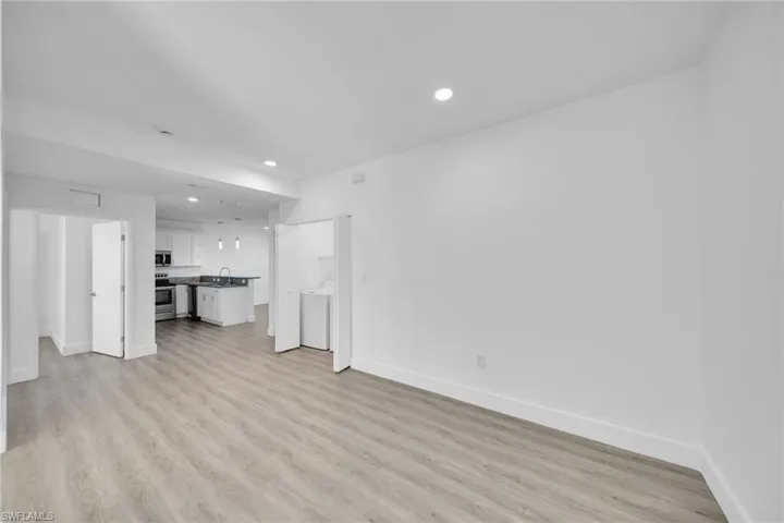 Light wood-finish flooring with recessed lighting