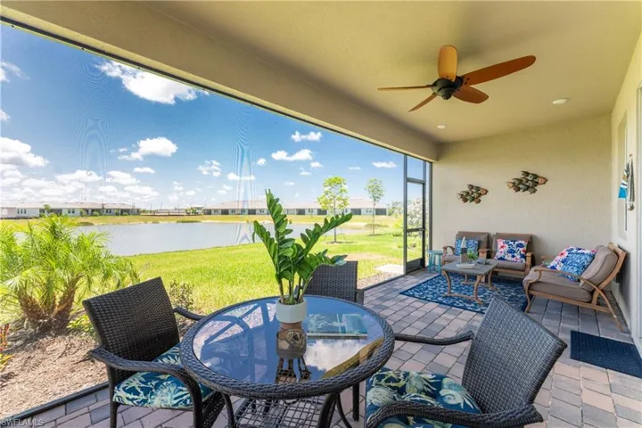 View of patio / terrace with a water view, outdoor lounge area, and ceiling fan