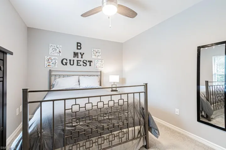 Bedroom featuring carpet and a ceiling fan