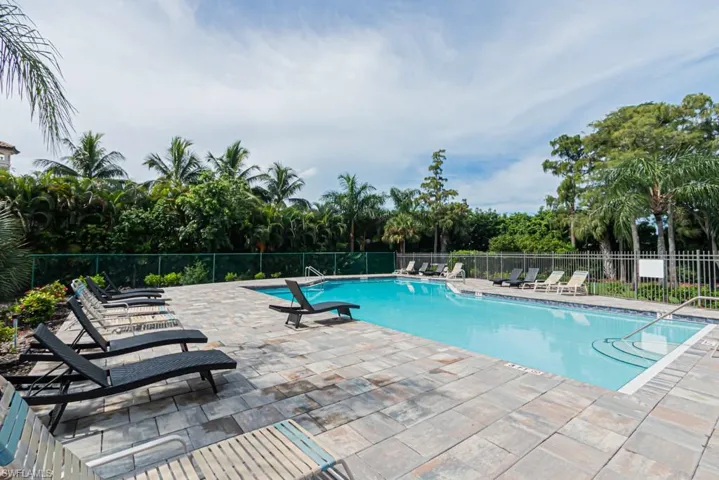 Community pool with a patio