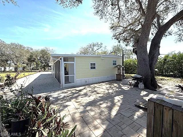Rear view of property featuring a patio area