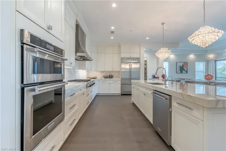 Foyer with grand marble staircase and elevator