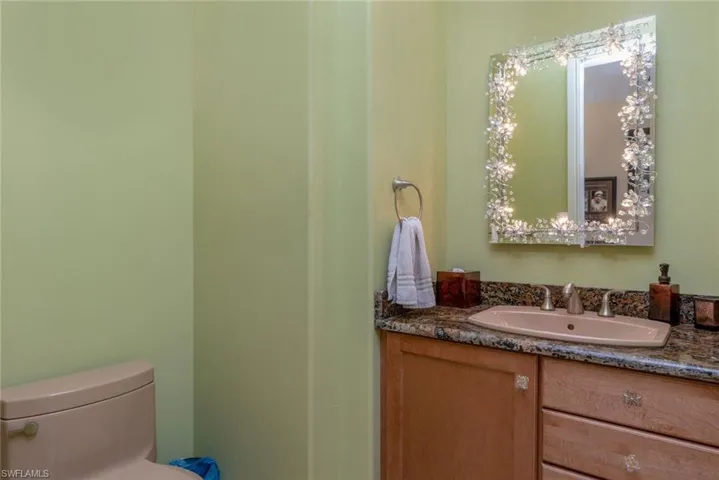 Half bath featuring crystal specialty lighting