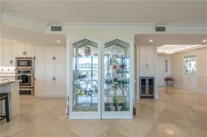 Entryway with ornamental molding and beverage cooler