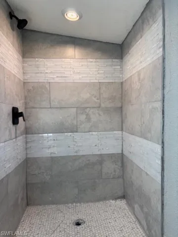 Bathroom with tiled shower