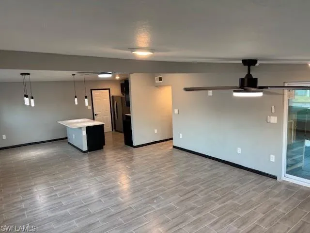 Unfurnished living room with light hardwood / wood-style flooring
