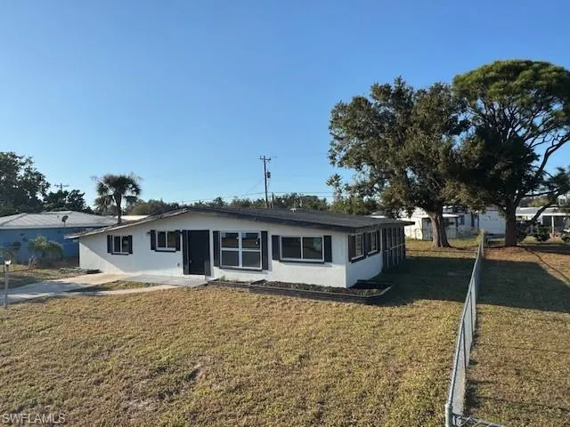Ranch-style home with a front yard