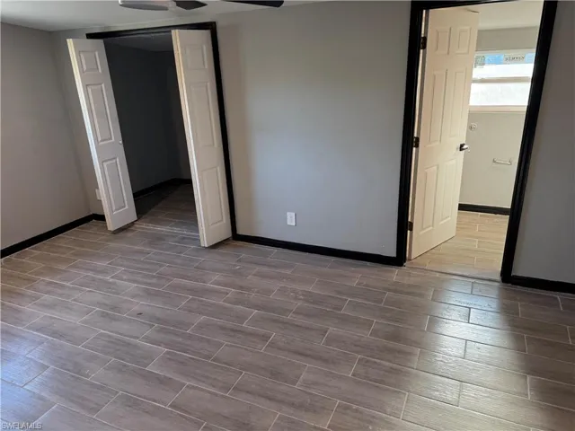 Empty room featuring ceiling fan