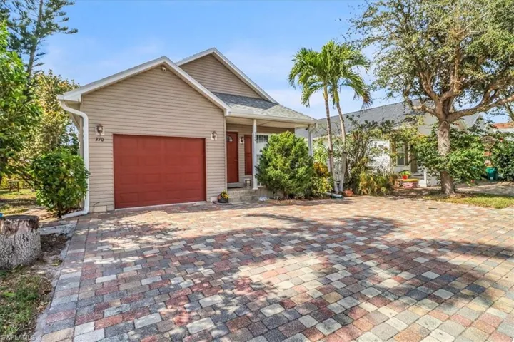 Plenty of paved parking with attached garage
