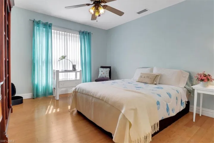 Bright bedroom with bamboo flooring
