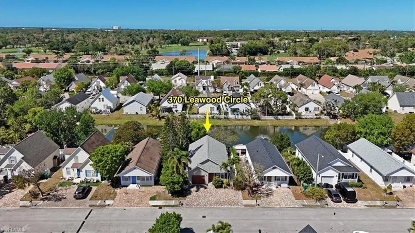 Drone / aerial view featuring a residential view and a water view