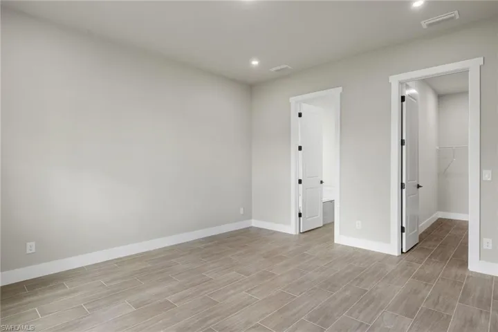 Spare room with light hardwood / wood-style flooring