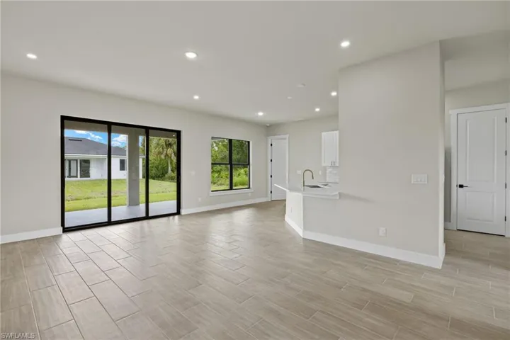 Unfurnished living room with sink