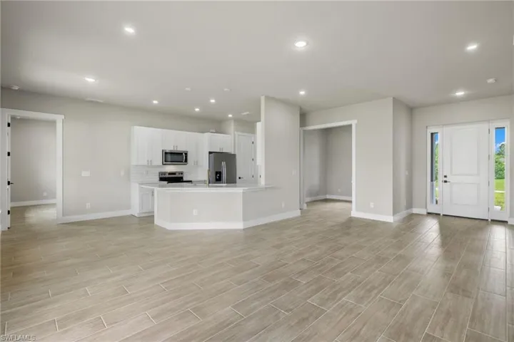 Unfurnished living room with light wood-type flooring