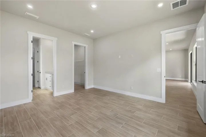 Master bedroom with large walk in closet and bathroom.