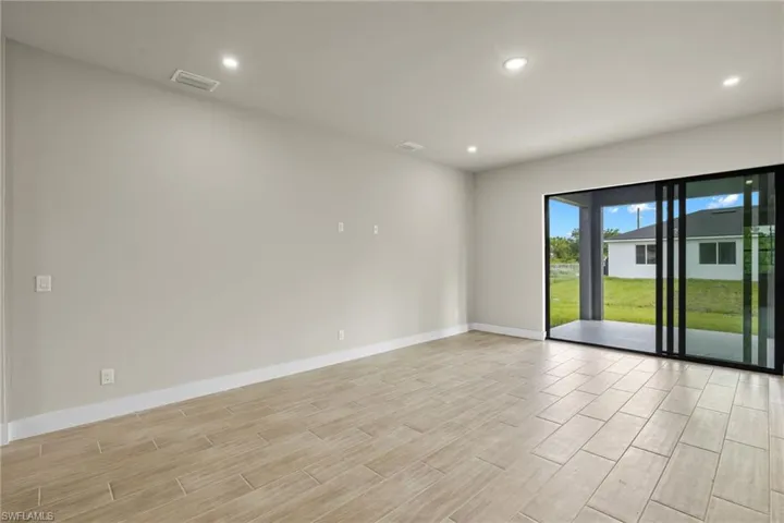 Unfurnished room featuring light wood-type flooring