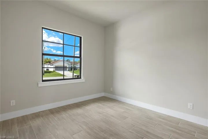 Empty room featuring light wood-type flooring