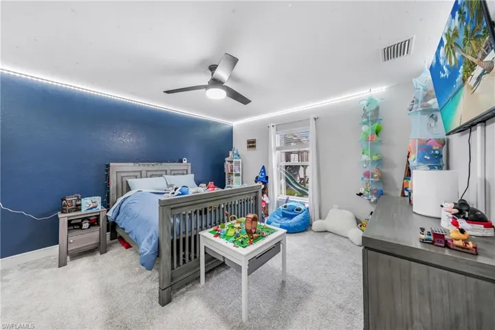 Bedroom with carpet floors and ceiling fan