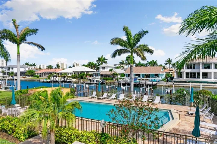 Peaceful view of the pool and landscaping