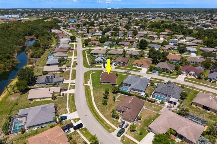 Residential neighborhood featuring single-story homes with shingle roofs and paved streets