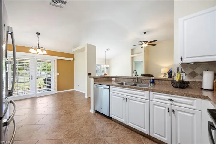 Kitchen has under cabinet lighting.