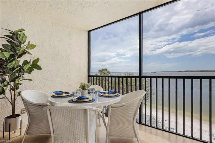 Sunroom with a water view