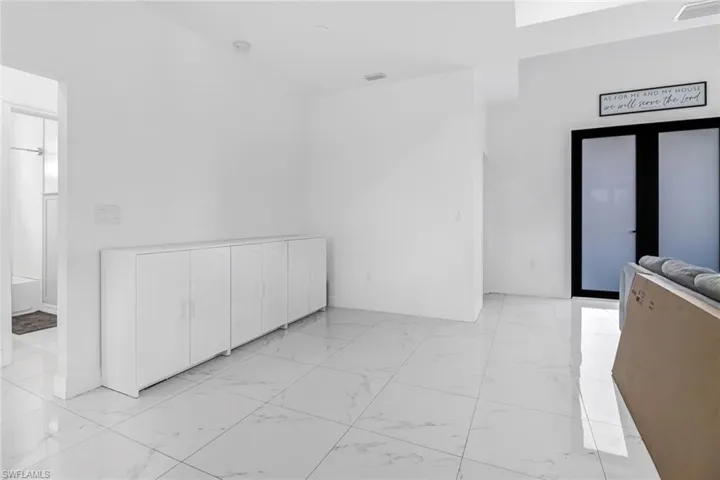 Spare room featuring light tile patterned floors