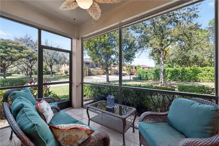 Sunroom featuring ceiling fan and outdoor seating