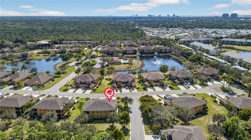Aerial view of residential area with a large body of water