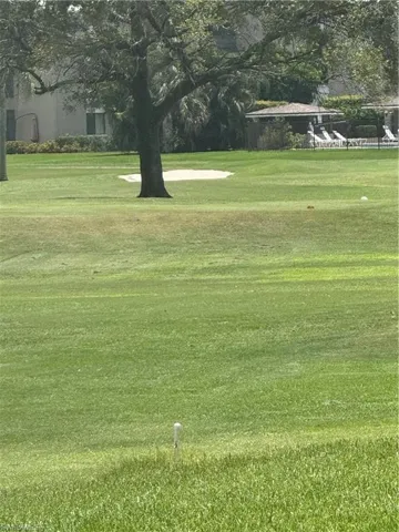 View of the back of the property, featuring a view of the golf course