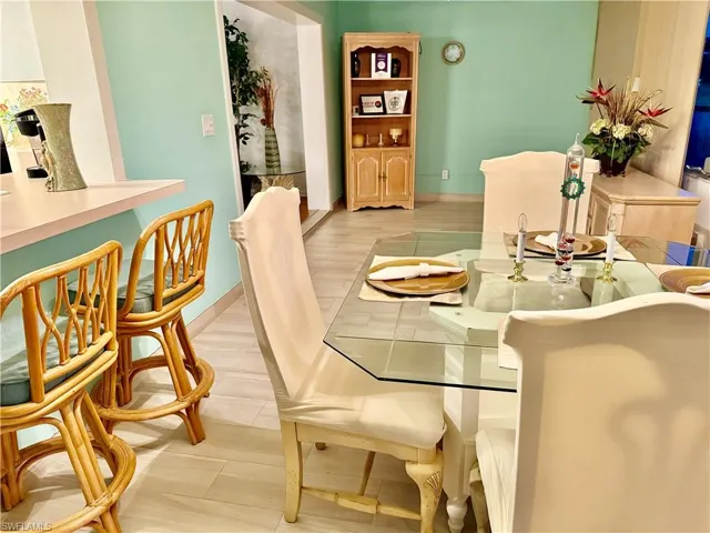 Dining area featuring baseboards and light wood-style flooring
