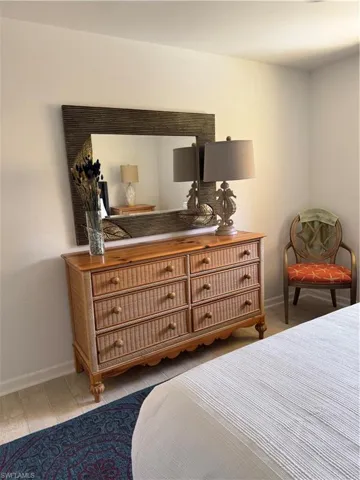 Bedroom with baseboards and light wood-style floors