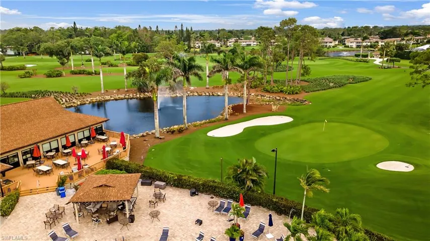 Aerial view with a water view and golf course view
